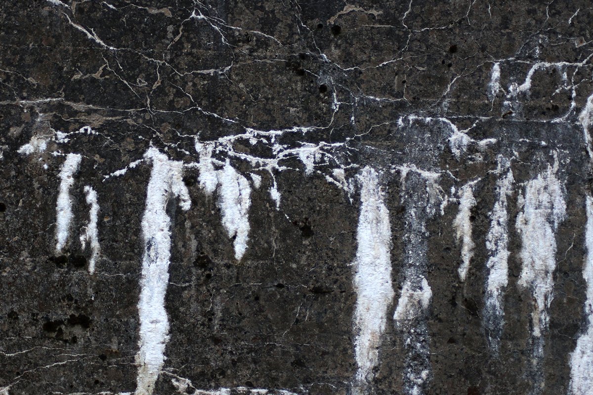 Powdery white efflorescence on basement concrete wall